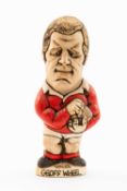 GROGG CARICATURE BY JOHN HUGHES OF GEOFF WHEEL standing on titled base, 'Wales Grand Slam 1976 and