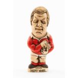 GROGG CARICATURE BY JOHN HUGHES OF GEOFF WHEEL standing on titled base, 'Wales Grand Slam 1976 and