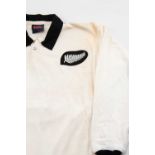 AN UNUSUAL NEW ZEALAND RUGBY UNION JERSEY white body with black collars, Canterbury label for