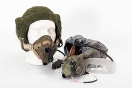 TWO RAF FLYING HELMETS WITH ASSOCIATED OXYGEN MASKS together with a pair of anti-fog goggles, MOD