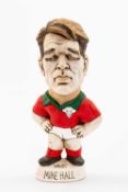 GROGG CARICATURE OF MIKE HALL (Grogg Shop Wales) standing on titled base, wearing his Wales No.13