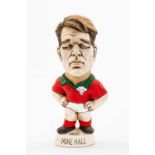 GROGG CARICATURE OF MIKE HALL (Grogg Shop Wales) standing on titled base, wearing his Wales No.13