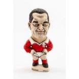 GROGG CARICATURE BY JOHN HUGHES OF DAVID EVANS standing on titled base, wearing his Wales No.10 kit,