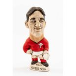 GROGG CARICATURE OF RUPERT MOON (Grogg Shop Wales) standing on titled base, wearing his Wales No.9