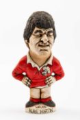 GROGG CARICATURE BY JOHN HUGHES OF ALAN MARTIN standing on a titled base, 'Wales Grand Slam 76,