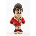 GROGG CARICATURE BY JOHN HUGHES OF ALAN MARTIN standing on a titled base, 'Wales Grand Slam 76,