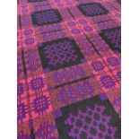 WELSH DERW WOOLEN TAPESTRY BLANKET, woven in pink, black, blue and claret, with fringe, 230 x