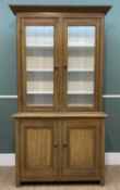 19TH CENTURY SCUMBLED PINE BOOKCASE, cavetto cornice over glazed doors enclosing painted interior of
