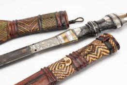 TUAREG DAGGER, in plaited leather double sheath, mixed metal and inlaid wood hilt, 46cm long