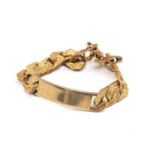 9CT GOLD FLAT CURB LINK CHAIN I. D. BRACELET, textured finish, stamped '375', 21.5cms long, 63.1gms