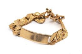 9CT GOLD FLAT CURB LINK CHAIN I. D. BRACELET, textured finish, stamped '375', 21.5cms long, 63.1gms