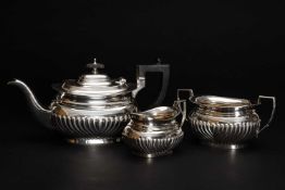 MATCHED THREE PIECE SILVER TEASET, half fluted, various hallmarks, 28 ozt approx. overall (3)