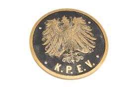 A RUSSIAN K.P.E.V. STATE RAILWAY CIRCULAR BRASS PLAQUE, 25cm diam.