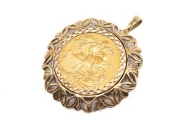 VICTORIAN GOLD SOVEREIGN, 1890, Jubilee head, in 9ct gold pierced floral pendant mount, 12.9gms