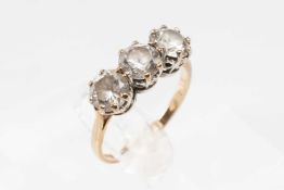 9CT GOLD THREE-STONE DIAMOND SIMULANT RING, the stones claw-set in white to a yellow shank