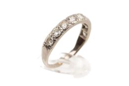 18CT WHITE GOLD NINE STONE DIAMOND RING, the nine stones measuring 0.7cts overall approx., ring size
