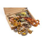 BOX OF COSTUME JEWELLERY comprising various beads including amber coloured, coral necklace,