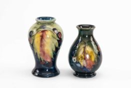 TWO SMALL MOORCROFT VASES, 'Leaf' and 'Berries' pattern, comprising baluster vase and pear shaped