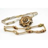 GOLD JEWELLERY comprising 9ct gold shield brooch, 9ct gold multi-gem bracelet and a 9ct gold bi-