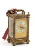 19TH CENTURY GILT BRASS CARRIAGE CLOCK, fancy case with enamel dial, swing handle. platform