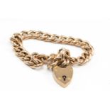 9CT GOLD CURB LINK BRACELET, heart shaped padlock, 10.7gms Provenance: deceased estate