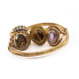 GOLD JEWELLERY comprising 9ct gold bangle, 9ct gold smoky quartz ring, yellow metal tiger's eye