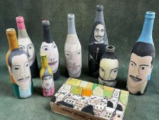 JOAQUIN BARRIOS (Mexican/Columbian, b.1956), painted glass bottles, each depicting faces of figures,