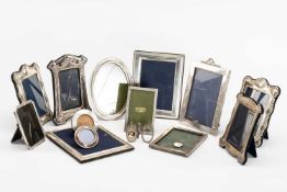 ASSORTED SILVER PHOTOGRAPH FRAMES, including pair with Rococo edges to the cushion frame, 21cms high