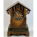 BLACK FOREST MANTEL CUCKOO CLOCK - gothic case, ebonised chaptering with applied Roman numerals,