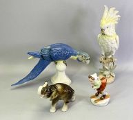 ROYAL DUX PORCELAIN - a Parakeet, yellow and cream, 41cms H, Parrot, blue and yellow, 22cms H,