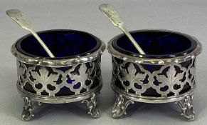 VICTORIAN SILVER TABLE SALTS, A PAIR - along with two non-matching spoons, Sheffield 1845, Henry