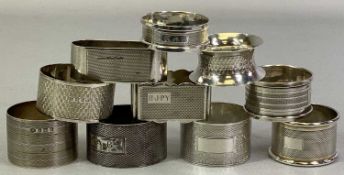 TEN BIRMINGHAM SILVER NAPKIN RINGS - all having engine turned decorations, various dates and maker's