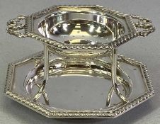 SILVER TEA STRAINER ON STAND - Sheffield 1938, maker Gladwin Ltd, twin handled octagonal shaped