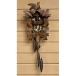GERMAN BLACK FOREST CUCKOO CLOCK - mid 20th Century, chalet style with musical carousel, three