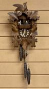 GERMAN BLACK FOREST CUCKOO CLOCK - mid 20th Century, chalet style with musical carousel, three