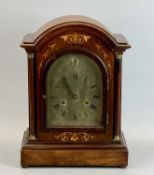 EDWARDIAN INLAID MAHOGANY DOME TOP MANTEL CLOCK - turned columns flanking the arched glazed door,