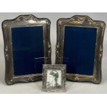 HALLMARKED SILVER PHOTOGRAPH FRAMES, A PAIR plus one other silver plated example, Sheffield 1993,