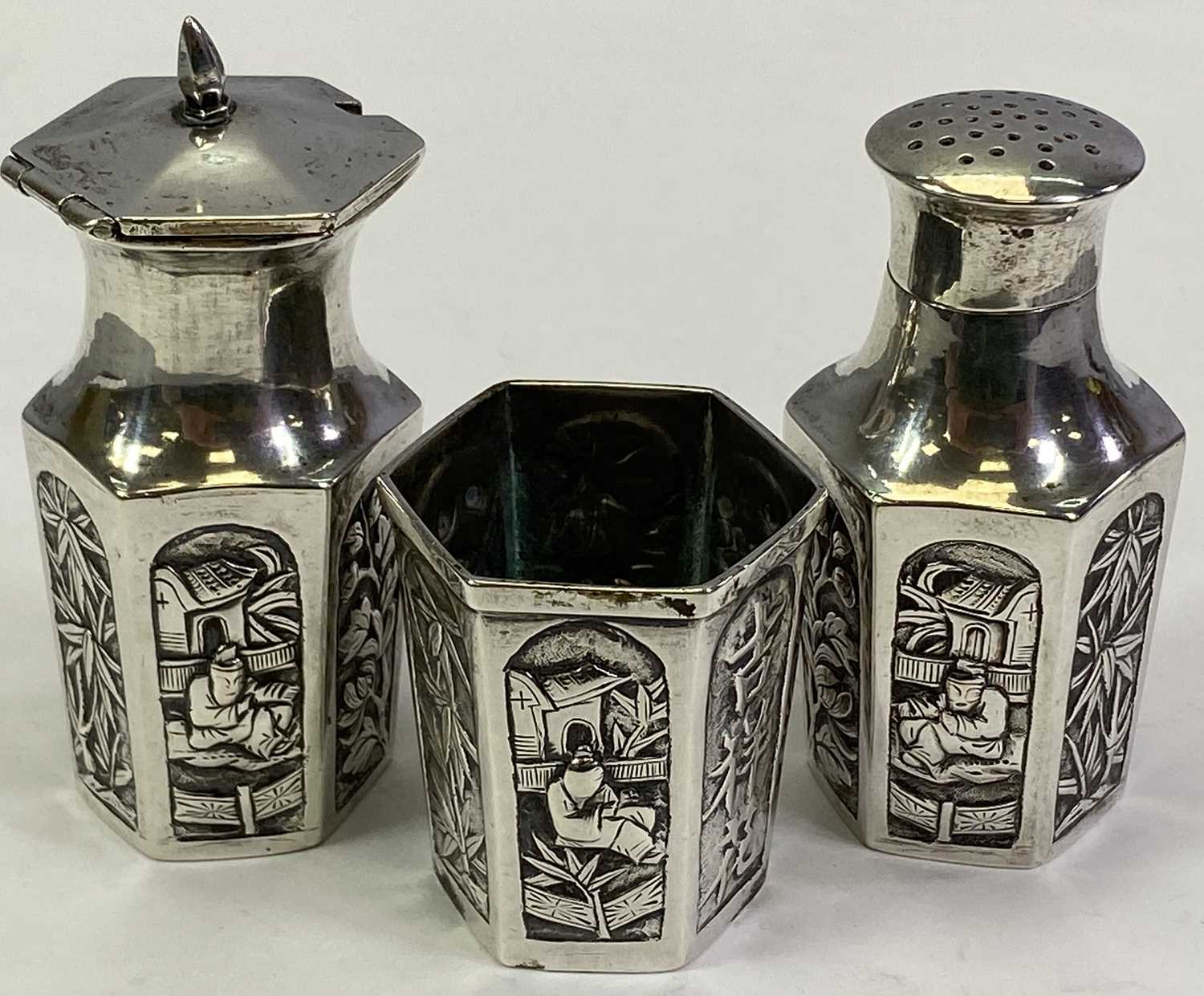 CHINESE UNMARKED WHITE METAL THREE PIECE CONDIMENT SET - comprising pepper pot, salt and lidded