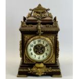 A FRENCH OAK & GILDED ORMOLU MOUNTED MANTEL CLOCK - late 19th Century, cream ceramic dial with black