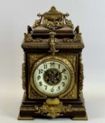 A FRENCH OAK & GILDED ORMOLU MOUNTED MANTEL CLOCK - late 19th Century, cream ceramic dial with black