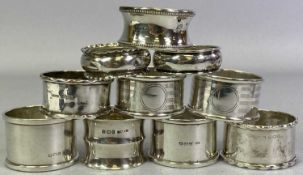 TEN BIRMINGHAM SILVER NAPKIN RINGS - in fairly plain form but including a pair having lined