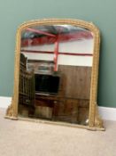 VICTORIAN GILT FRAMED OVERMANTEL MIRROR - decorated with leaf and berry design, arched top with