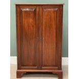 VICTORIAN MAHOGANY TWO DOOR STORAGE CUPBOARD - having chamfered panels to the doors, on corner