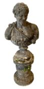 RE-CONSTITUTED STONE ORNAMENTAL GARDEN BUST - on a circular base, 155cms H overall, 68cms shoulder