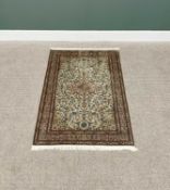G H FRITH KASHMIRI SILK GREEN RECTANGULAR RUG - busy central floral design with patterned borders