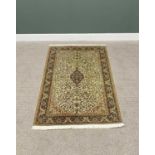 G H FRITH KASHMIRI SILK GREEN RECTANGULAR RUG - floral centre within a patterned border and