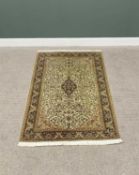 G H FRITH KASHMIRI SILK GREEN RECTANGULAR RUG - floral centre within a patterned border and