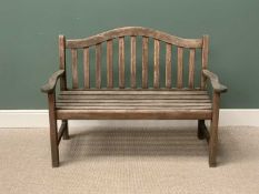 TEAK SLATTED GARDEN BENCH - having a shaped back and arms, 95cms H, 129cms W, 51cms D