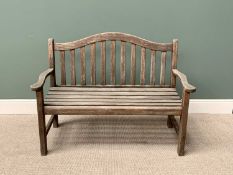 TEAK SLATTED GARDEN BENCH - having a shaped back and arms, 95cms H, 129cms W, 51cms D