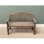 TEAK SLATTED GARDEN BENCH - having a shaped back and arms, 95cms H, 129cms W, 51cms D